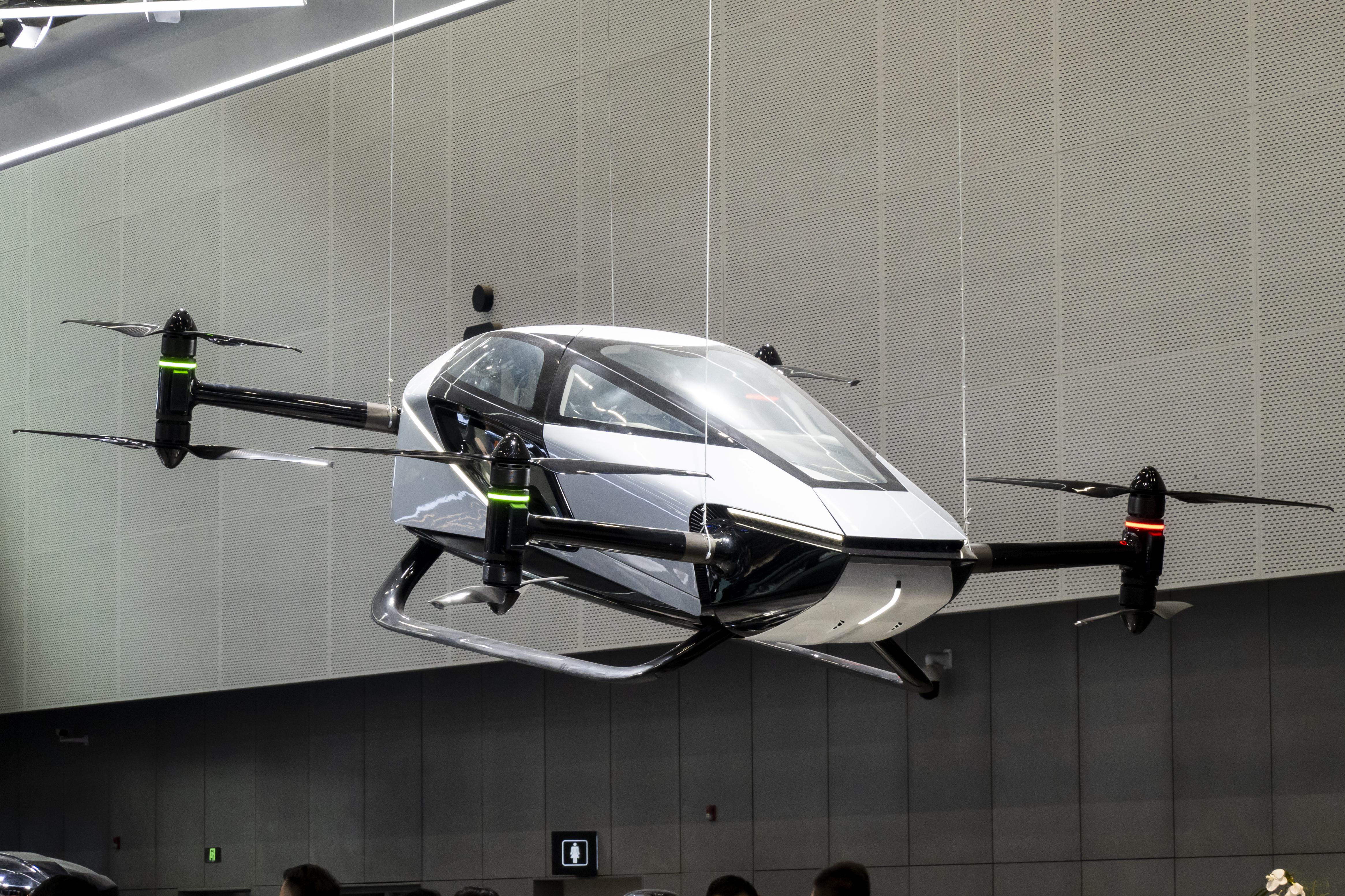 Electric vertical takeoff and landing aircraft (eVTOL) concept flying over a modern city skyline
